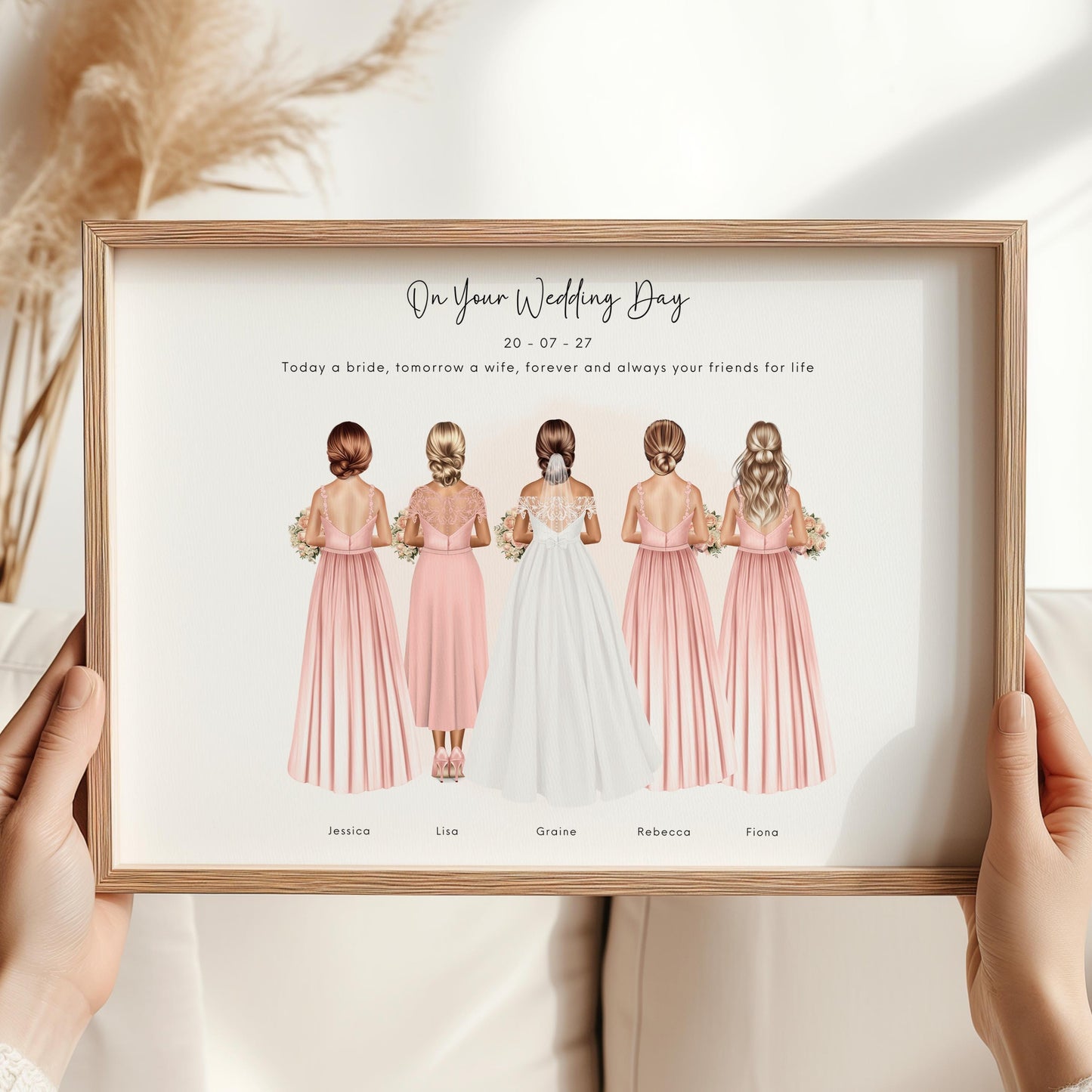 Personalised bridesmaid print showing bride and four bridesmaids from the back in blush pink dresses, holding bouquets, with names and wedding date underneath in a minimalist framed design.