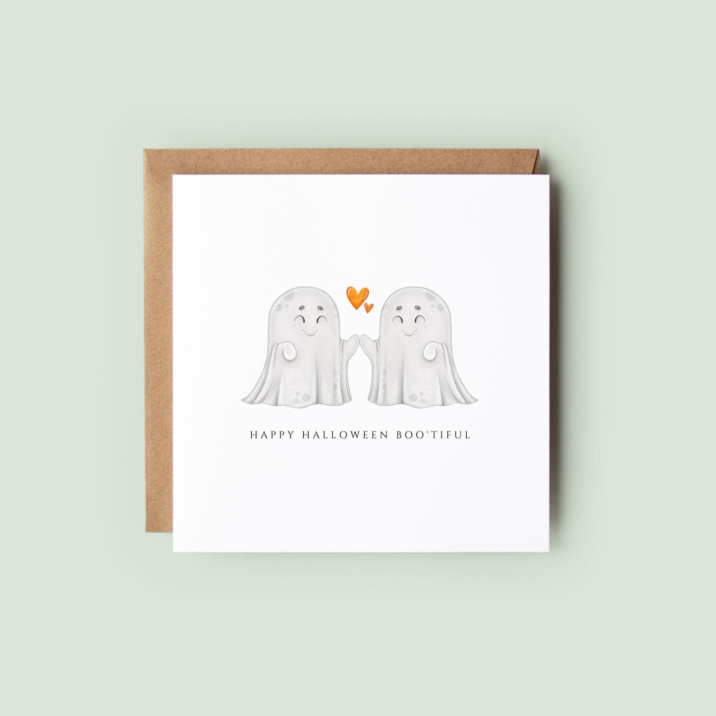 Cute Halloween greeting card featuring two smiling ghost characters high-fiving beneath orange hearts with the message "Happy Halloween Boo'tiful."