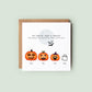 Personalised Halloween pregnancy announcement card featuring a pumpkin family with names and a ghost baby, and the message “Our family is growing by two little feet.”