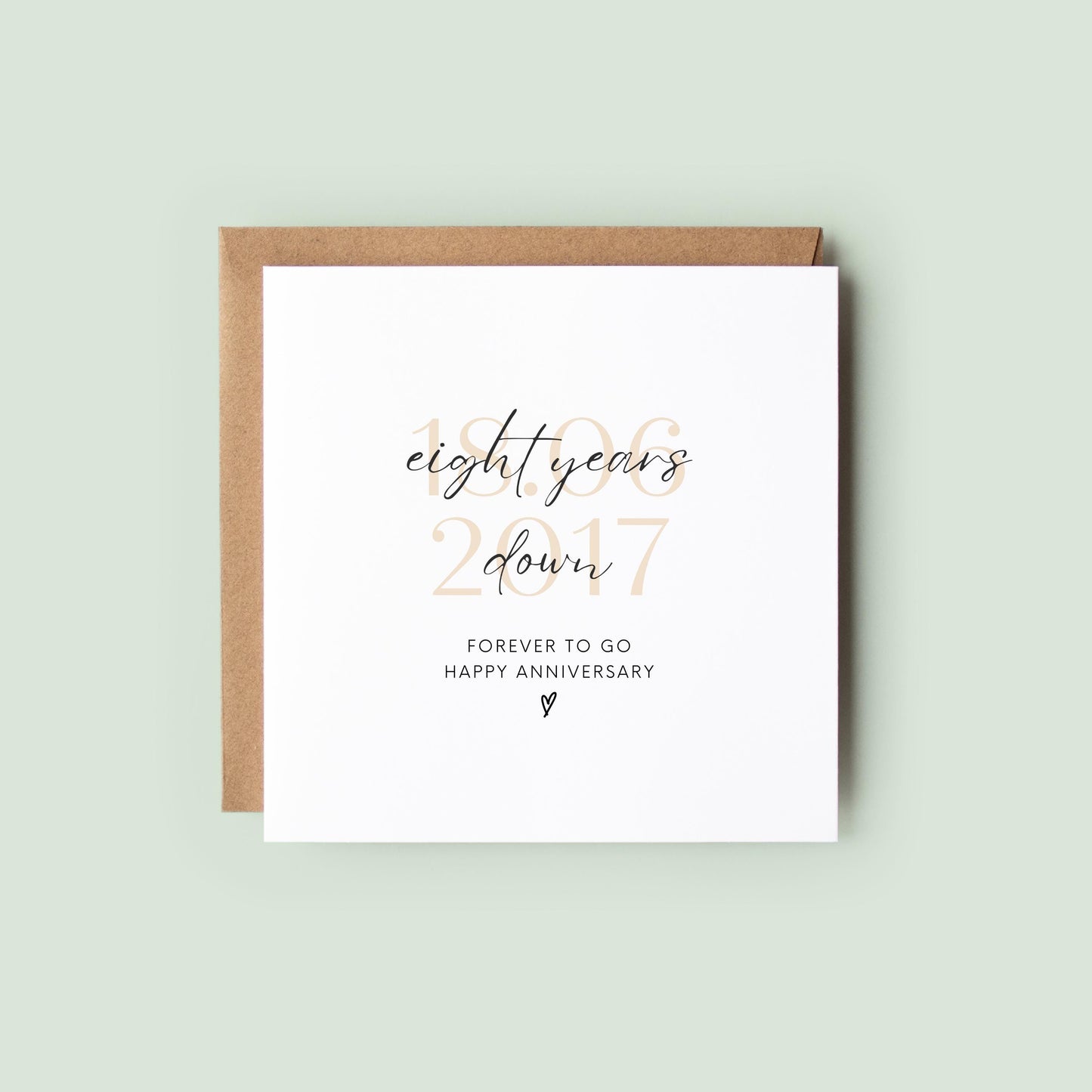 Personalised eight-year anniversary card featuring soft beige date, script text reading “Eight Years Down”, and a small heart detail.