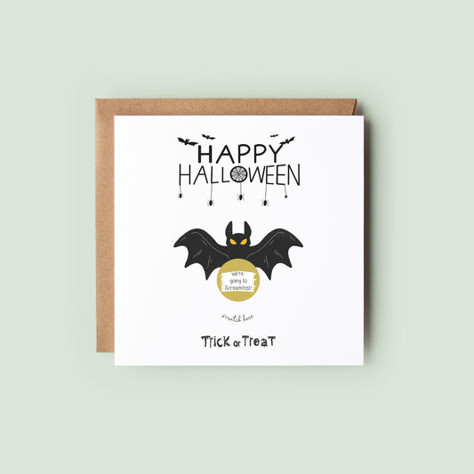 Square Halloween scratch card featuring a black bat with yellow eyes and a gold scratch-off circle that hides a surprise message. Text reads “Happy Halloween” and “Trick or Treat” in spooky fonts.