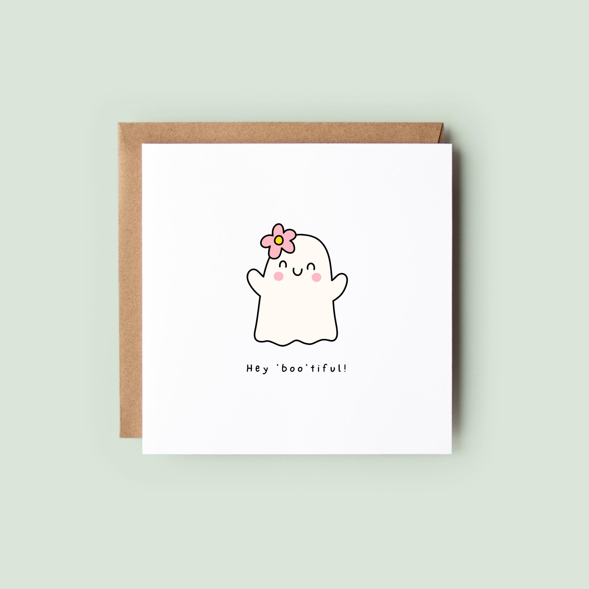 Cute Halloween card with ghost illustration, pink flower, and the phrase “Hey Boo’tiful!”