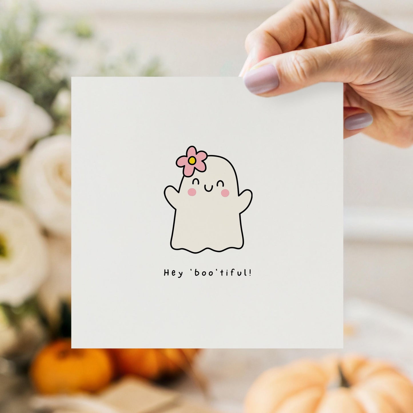 Cute Halloween card with ghost illustration, pink flower, and the phrase “Hey Boo’tiful!”