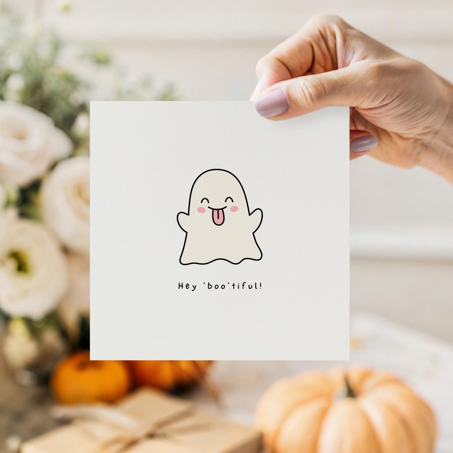 Cute Halloween card featuring a ghost with its tongue out and the phrase “Hey Boo’tiful!”