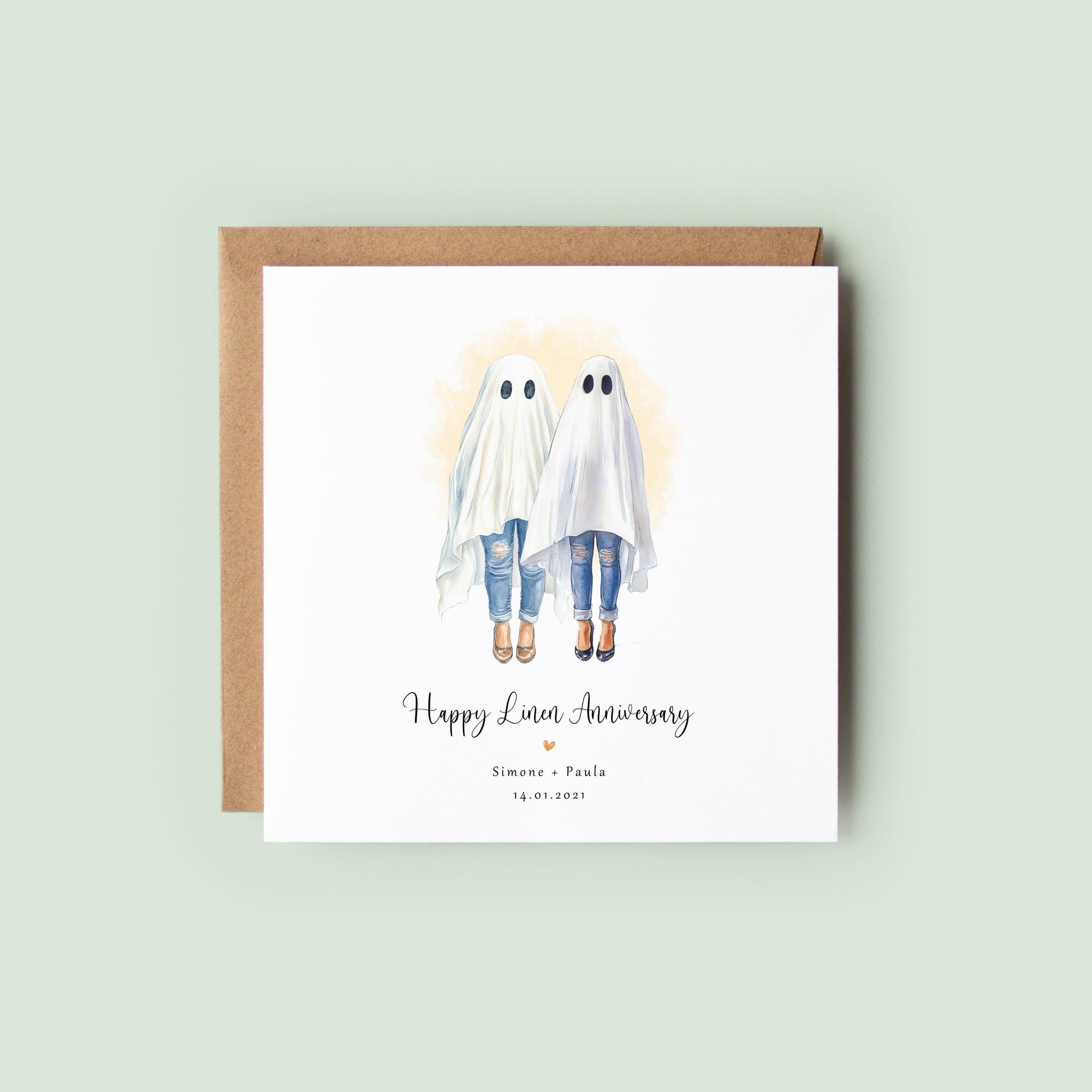 Personalised lesbian linen anniversary card featuring two women dressed as ghosts in a cute Halloween watercolour style, with names and wedding date.
