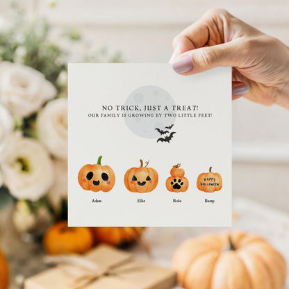 Personalised Halloween pregnancy announcement card featuring a family of customisable watercolour pumpkins with names and the message "No Trick, Just a Treat! Our Family is Growing by Two Little Feet!"