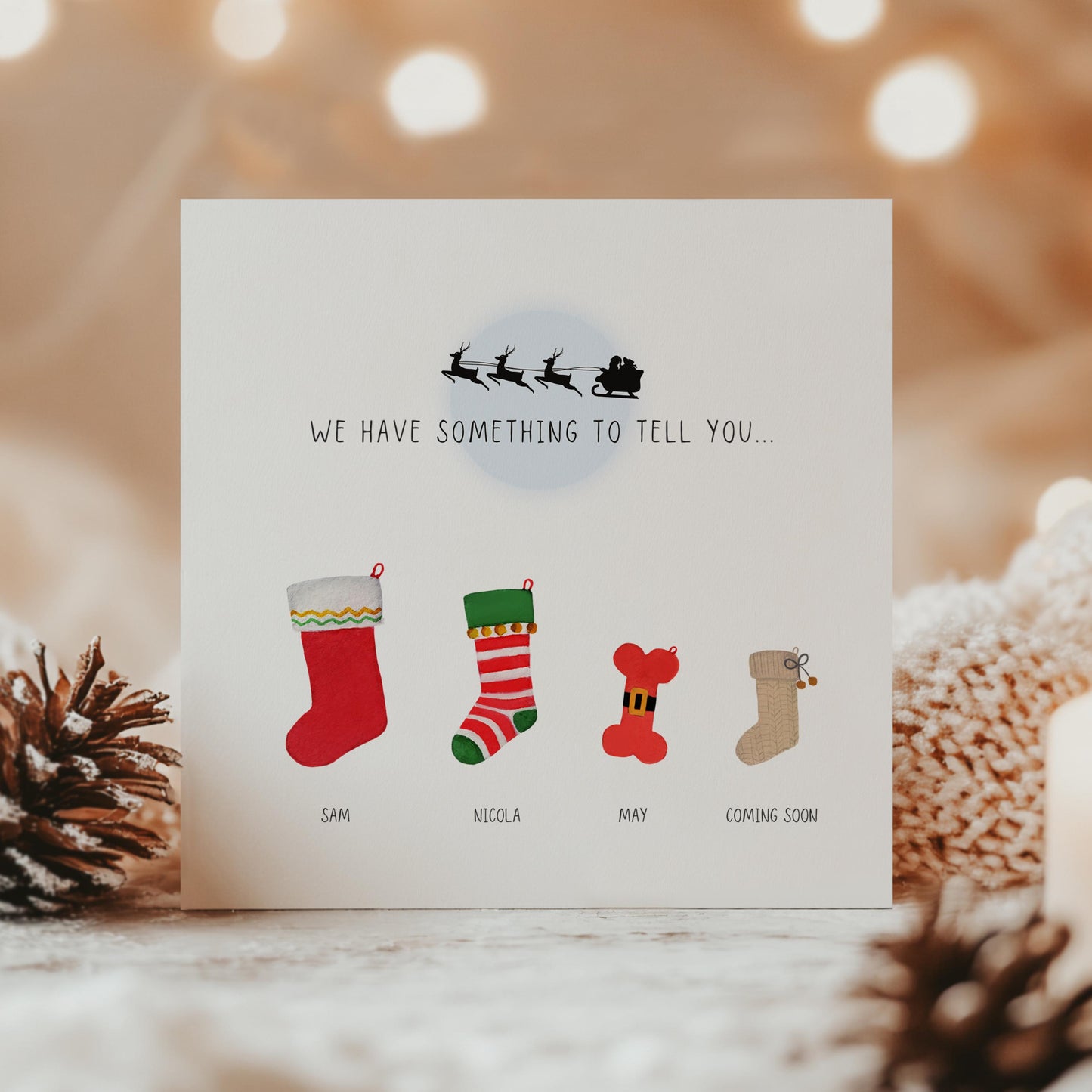 Personalised Christmas pregnancy announcement card with festive stockings and “Santa isn’t the only one coming to town” text, ideal for sharing baby news.