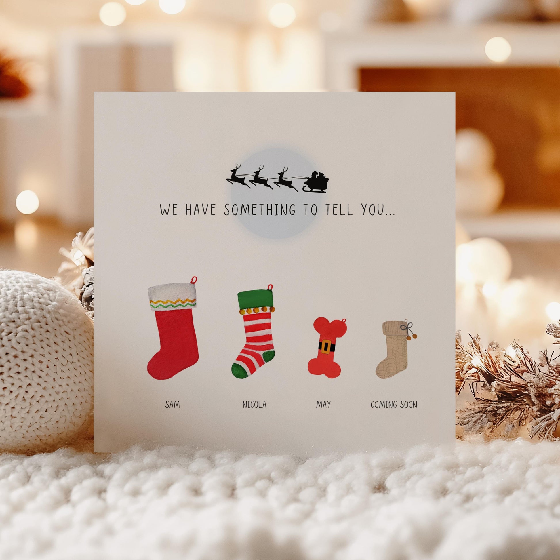 Personalised Christmas pregnancy announcement card with festive stockings and “Santa isn’t the only one coming to town” text, ideal for sharing baby news.
