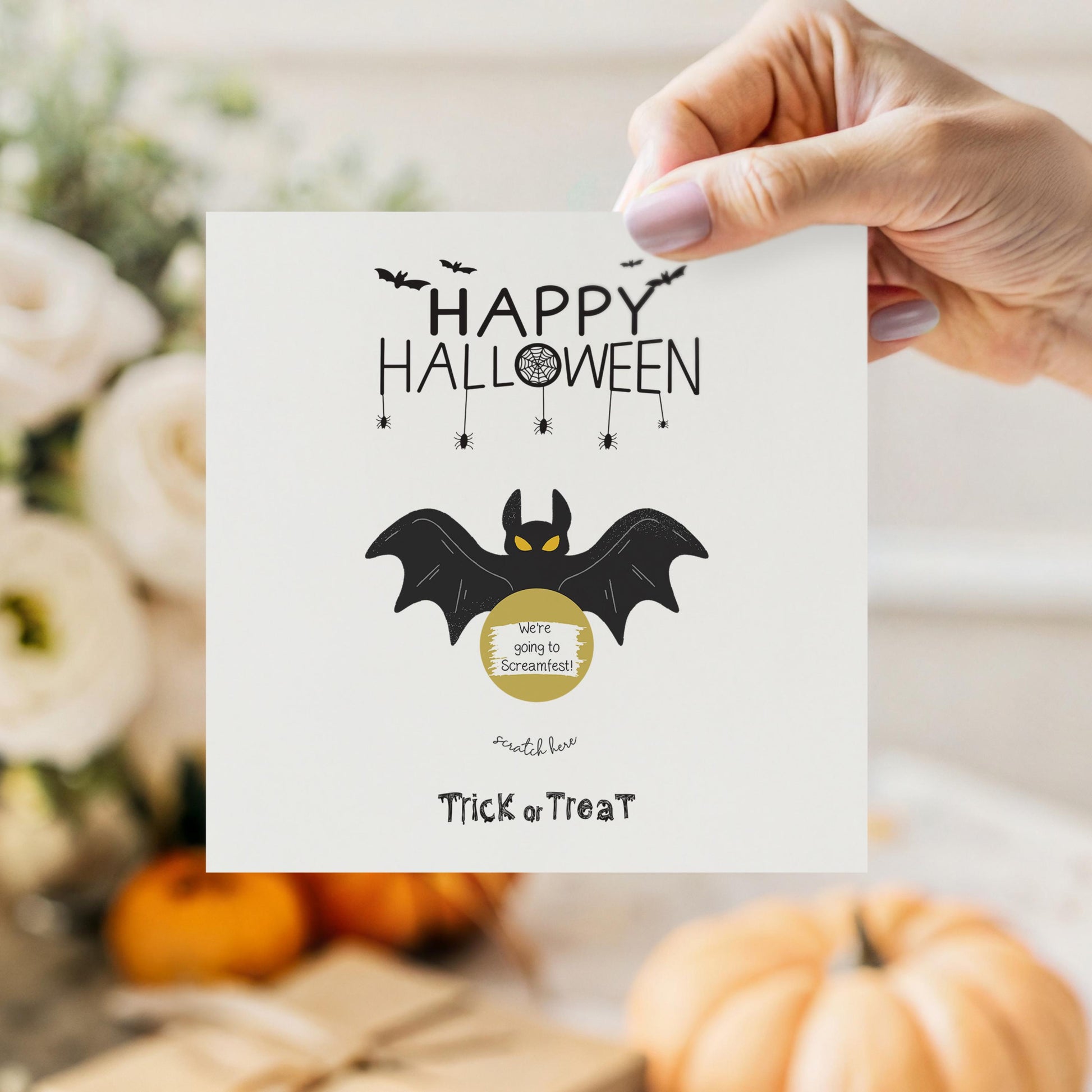 Square Halloween scratch card featuring a black bat with yellow eyes and a gold scratch-off circle that hides a surprise message. Text reads “Happy Halloween” and “Trick or Treat” in spooky fonts.
