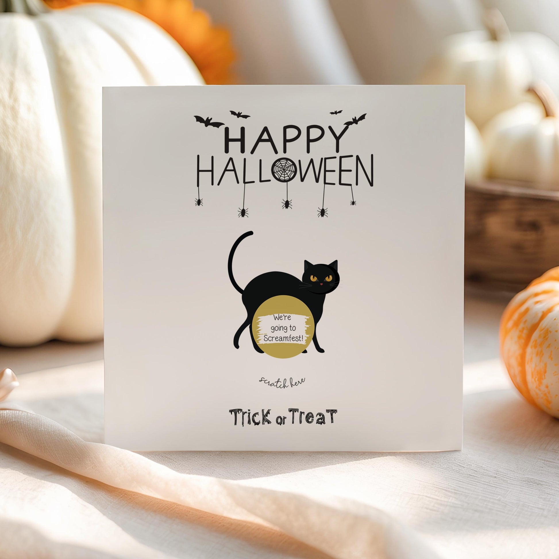 Halloween scratch card with a black cat and gold scratch-to-reveal area that uncovers a gift message.