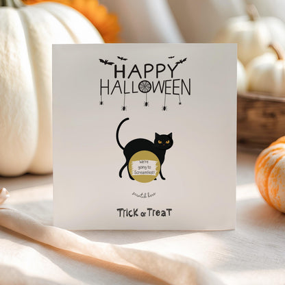 Halloween scratch-off greeting card featuring a black cat and a personalised scratch-to-reveal surprise message.