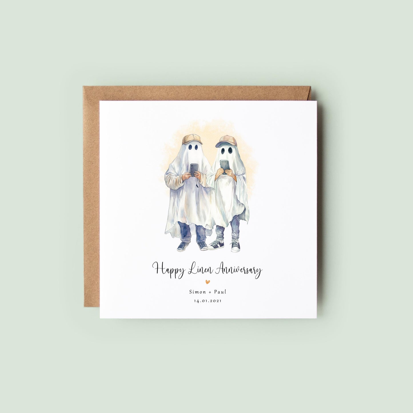 Personalised linen anniversary card featuring a ghost couple in Halloween costumes holding a pumpkin bucket, with custom names and wedding date.