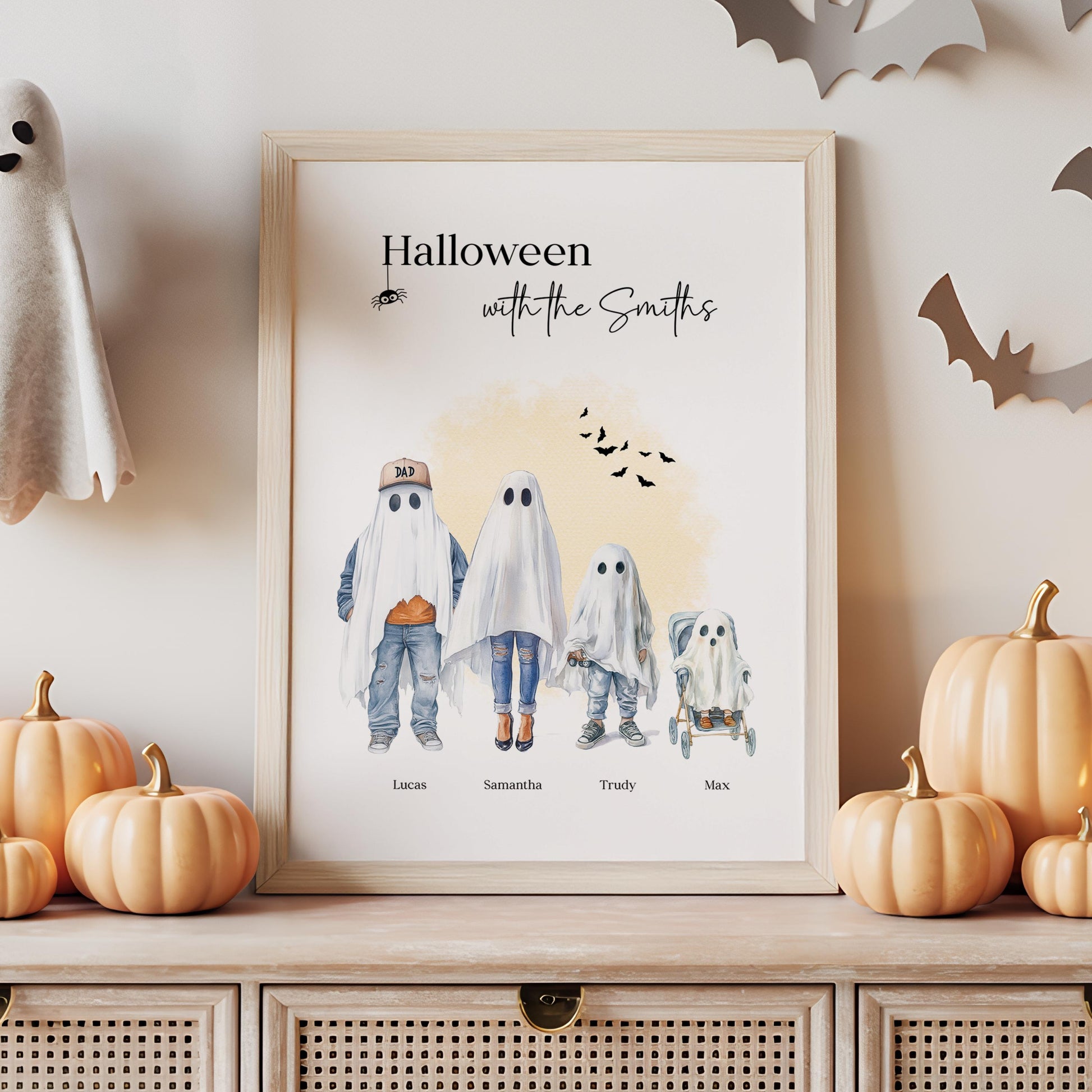 Personalised Halloween family print with four ghost characters, each labelled with a name, in a spooky watercolour style. Features parents, child, and baby in pram, perfect for autumn home décor.