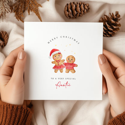 Cute Auntie Christmas card featuring festive gingerbread characters. A thoughtful Christmas greeting printed on premium recycled cardstock.