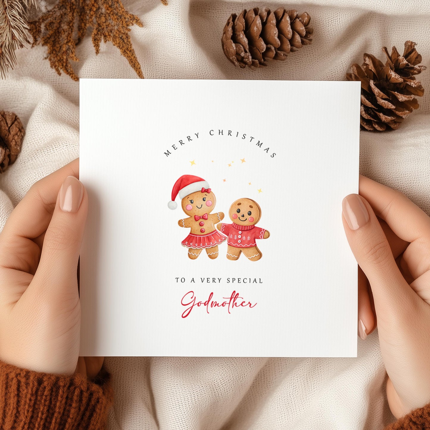 Christmas card featuring a gingerbread godmother and godson in festive jumpers with “Merry Christmas to a very special Godmother” text on cosy background.