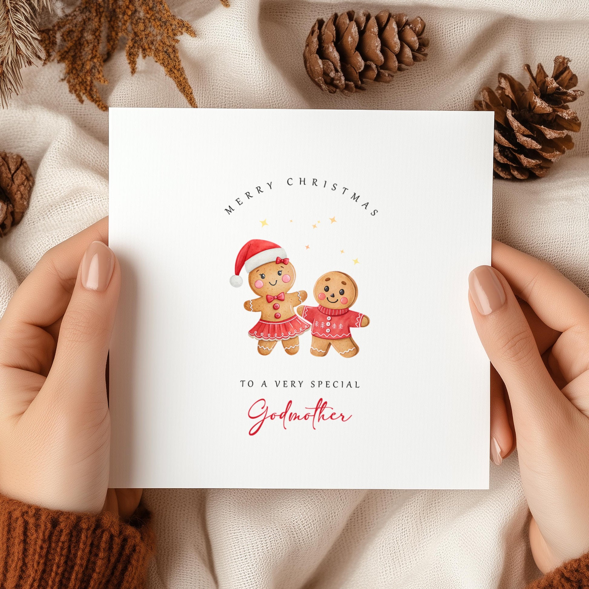 Christmas card featuring a gingerbread godmother and godson in festive jumpers with “Merry Christmas to a very special Godmother” text on cosy background.