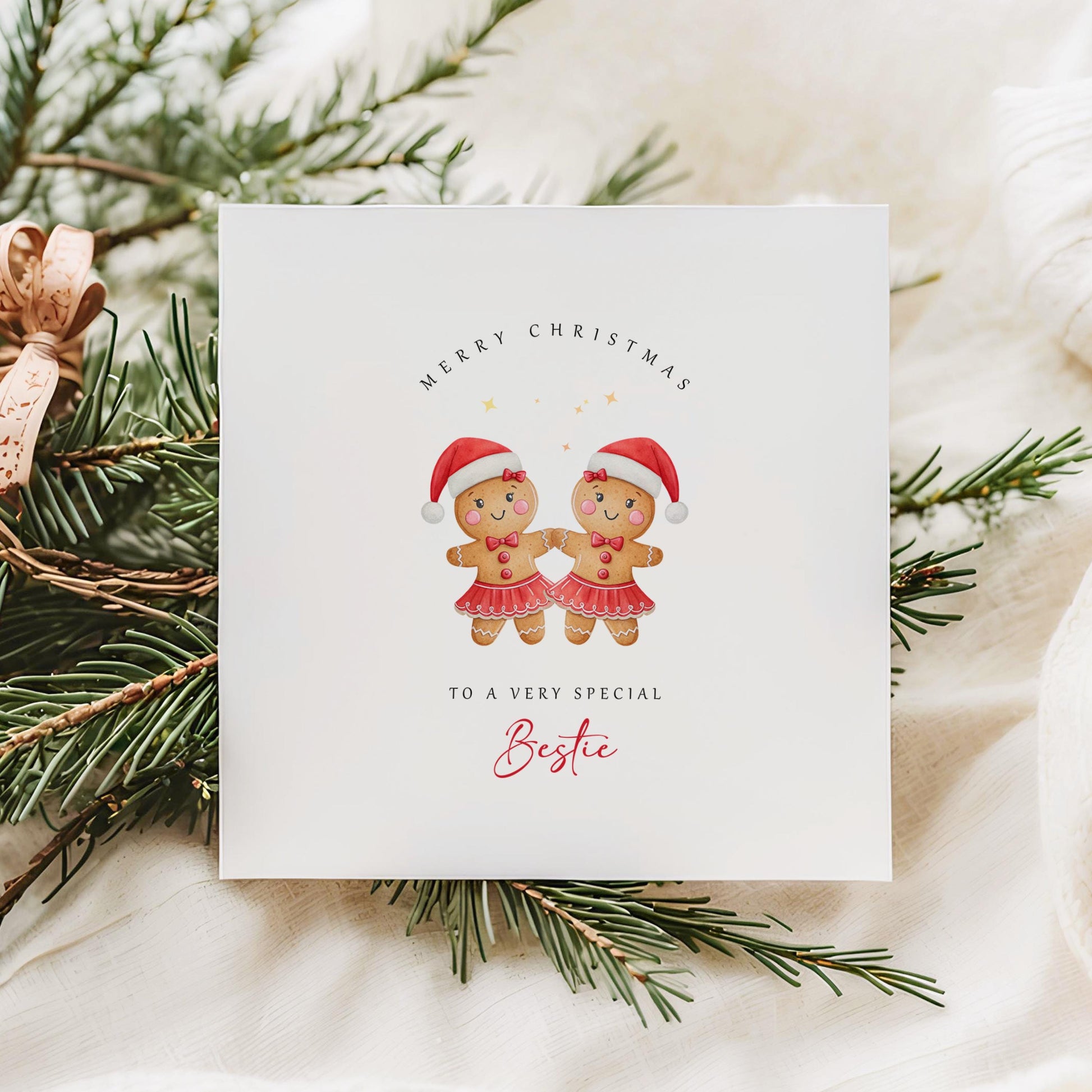 Best Friend Christmas card featuring two smiling gingerbread girls wearing Santa hats and festive skirts.