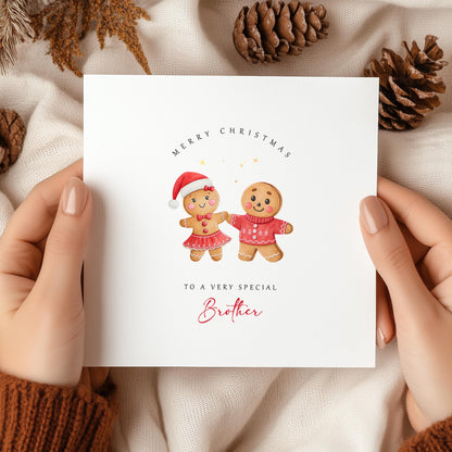 Gingerbread boy and girl holding hands on a festive Christmas card with the text “To a very special Brother” – perfect from a sister.