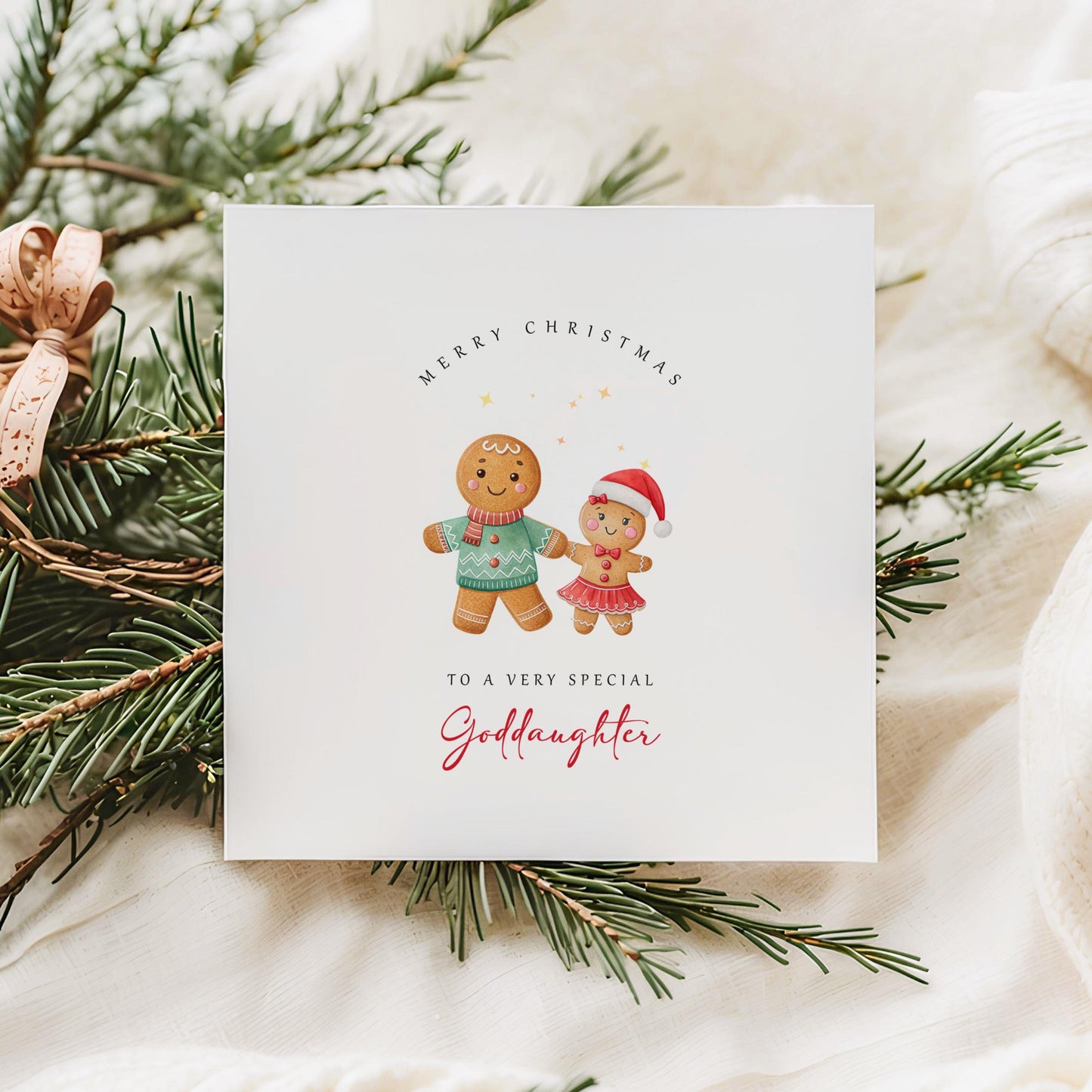 Christmas card from godfather to goddaughter with two gingerbread girls in Santa hats, set against a festive, cosy holiday background.