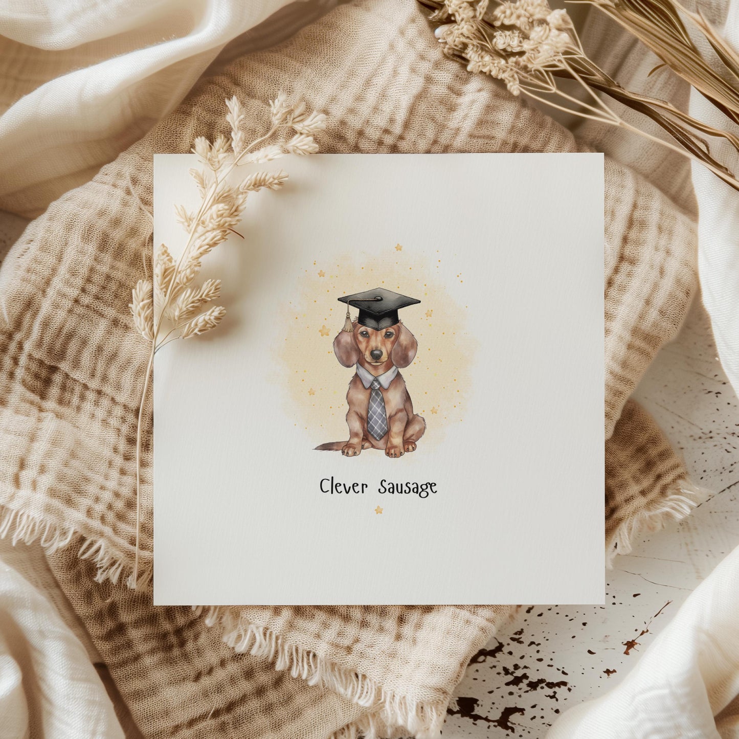 Funny dachshund graduation card featuring a sausage dog wearing a graduation cap and tie with the wording “Clever Sausage”. Humorous graduation congratulations card for dog lovers, university graduates and dachshund owners.