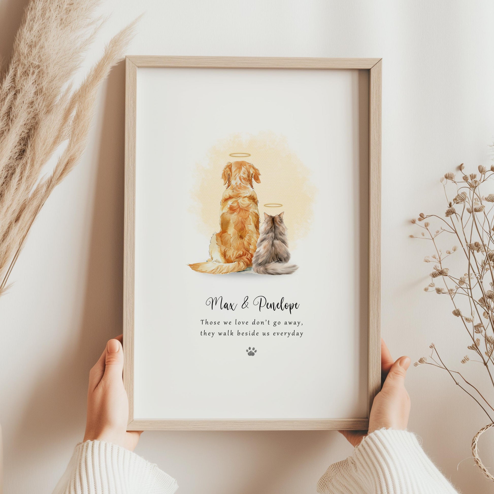 Personalised dog and cat memorial print showing two pets with halos on a soft yellow watercolour background, with their names and a remembrance quote beneath, modern Rainbow Bridge pet loss wall art.