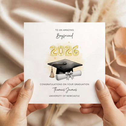 Personalised Boyfriend graduation card featuring graduation cap, diploma scroll and custom graduation year. Personalised with graduate’s name, university and special message. Keepsake congratulations card for boyfriend graduation.