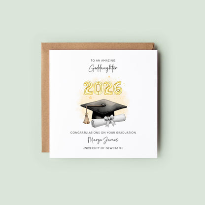 Personalised goddaughter graduation card featuring gold 2026 balloons, graduation cap and diploma scroll. Custom university graduation card with goddaughter title, graduate name, university details and congratulations message.