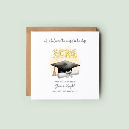 Personalised graduation card for him featuring gold 2026 balloons, graduation cap and diploma scroll. Custom graduate card with degree title, graduate name, university and motivational graduation quote.