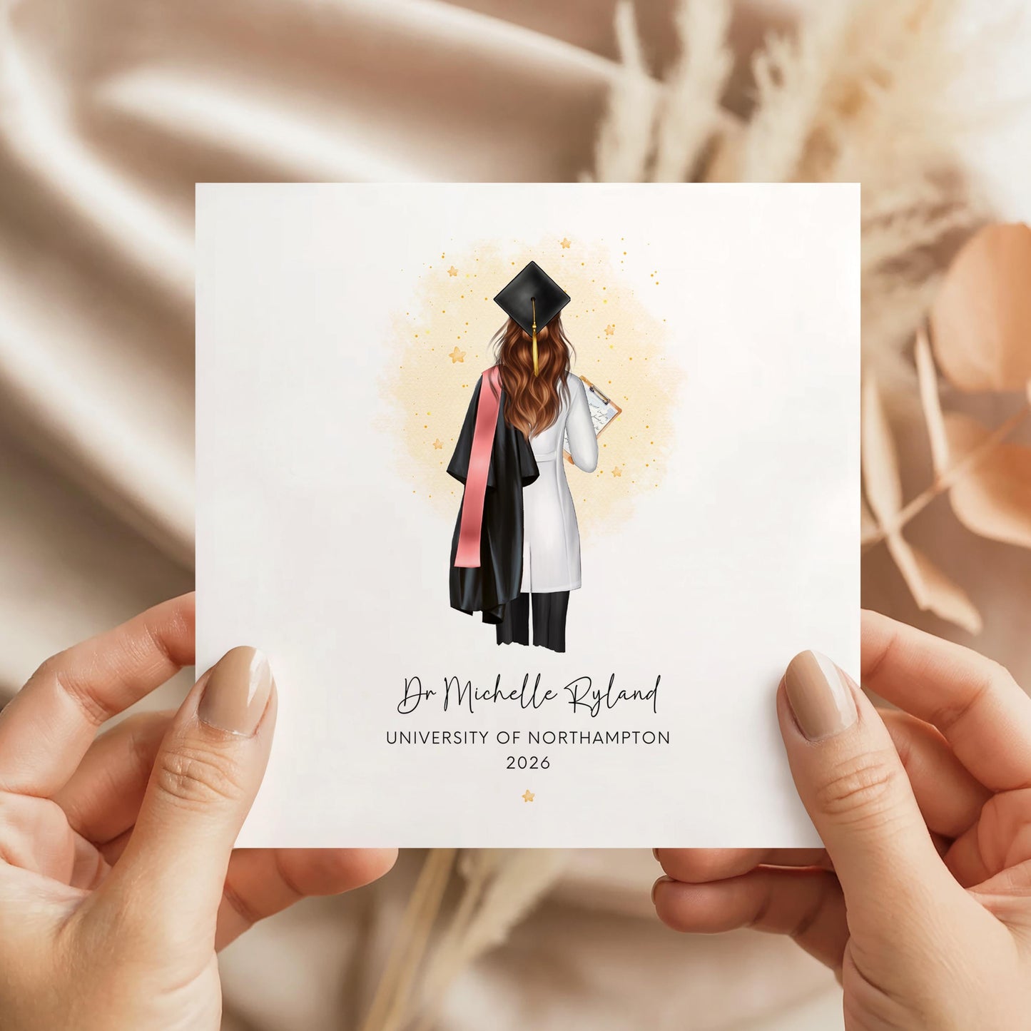 Personalised female doctor graduation card featuring a graduate in cap and gown with white medical coat and clipboard, customised with name, university and graduation year, shown with personalisation options for hair, sash and skin tone.