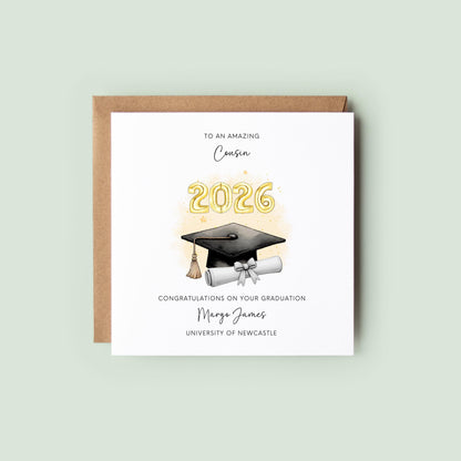 Personalised cousin graduation card featuring a graduation cap, diploma scroll and gold 2026 balloons. Custom graduation card with cousin title, graduate name, university and congratulatory message for university or college graduates.