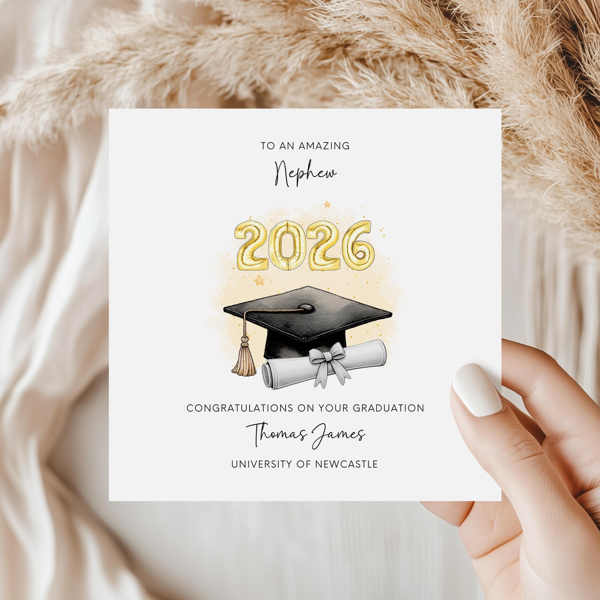 Personalised nephew graduation card featuring gold 2026 balloons, graduation cap and diploma scroll. Custom university graduation card with nephew title, graduate name, university details and congratulations message.