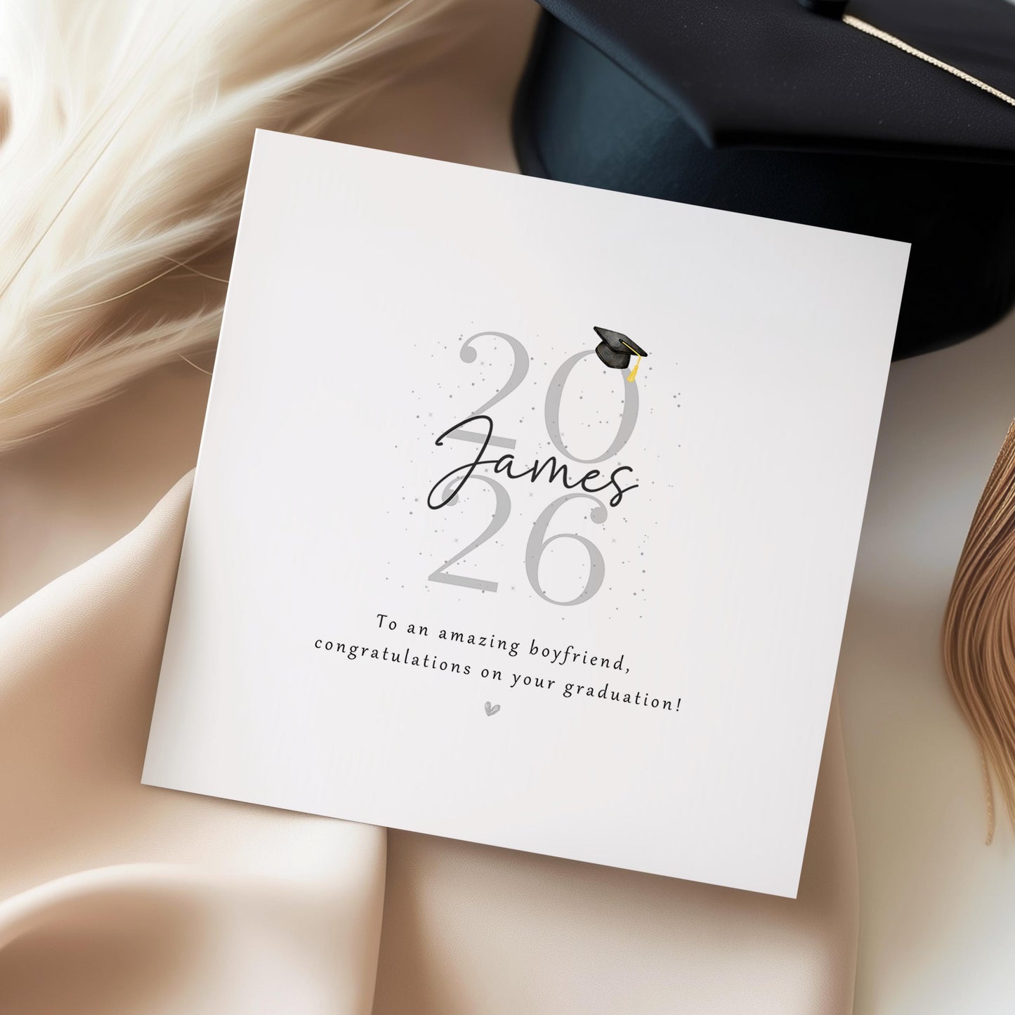Personalised graduation card for boyfriend featuring custom name, Class of 2026 design, graduation cap, personalised message and heart colour on a modern minimalist keepsake card.