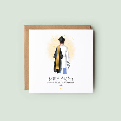 Personalised doctor graduation card featuring a medical graduate in cap and gown with scrubs and stethoscope, customised with name, university and graduation year, displayed with personalisation options.