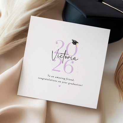 Personalised graduation card for a friend featuring custom name, graduation year and congratulations message with graduation cap illustration and Kraft envelope.