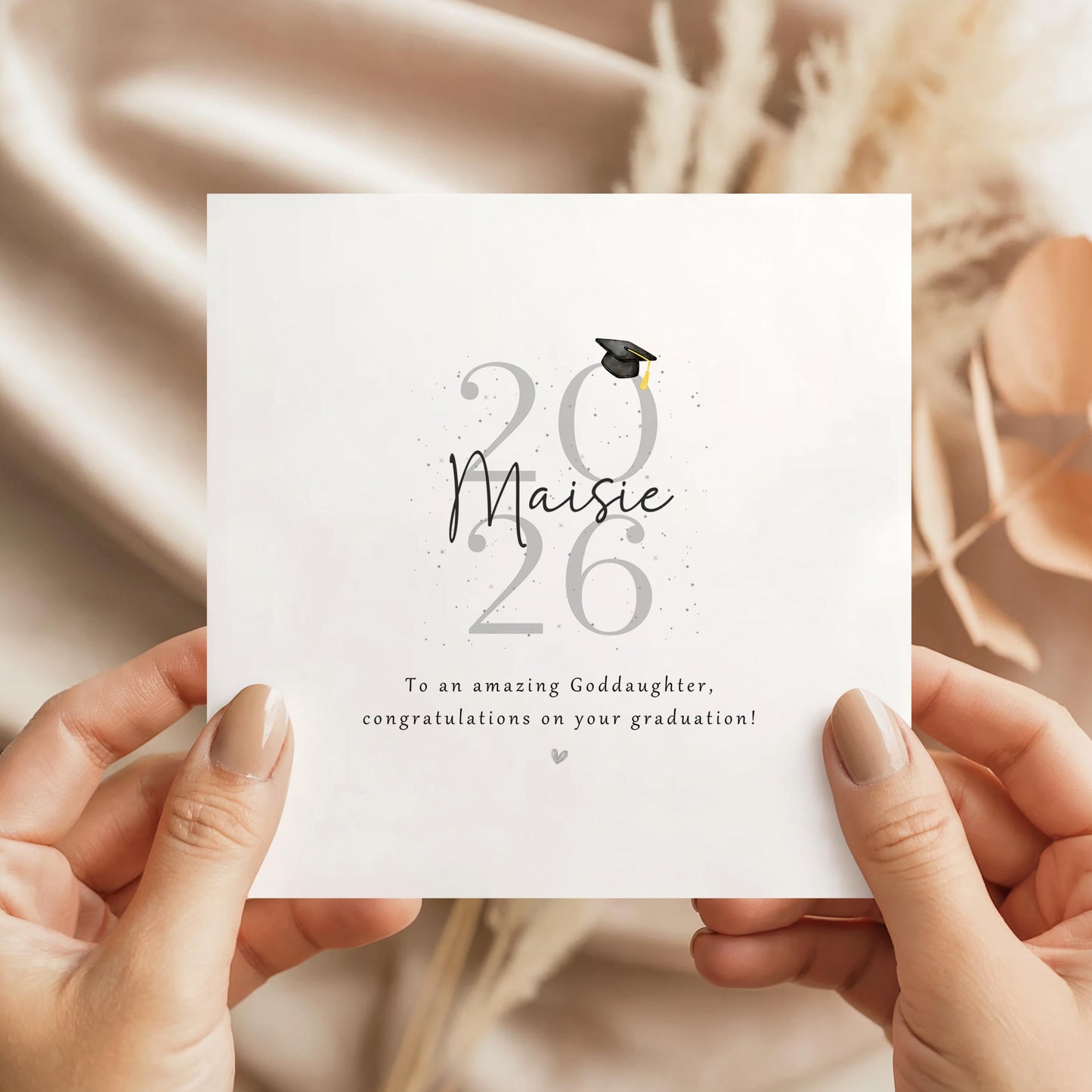 Personalised goddaughter graduation card featuring custom name, graduation year and congratulations message with graduation cap illustration and Kraft envelope.