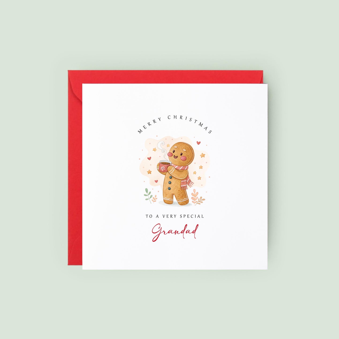 Cute Grandad Christmas card featuring a smiling gingerbread character wearing a scarf and holding a warm festive drink.