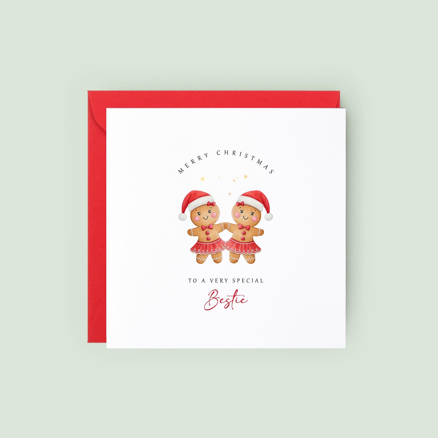 Best Friend Christmas card featuring two smiling gingerbread girls wearing Santa hats and festive skirts.
