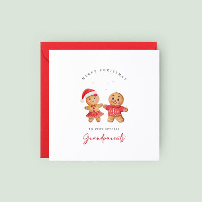 Christmas card for grandparents featuring a festive gingerbread couple wearing Christmas outfits.