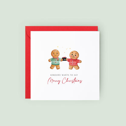 Announce your pregnancy this Christmas with a cute LGBTQ+ gingerbread card for two dads, featuring a festive baby scan reveal design.