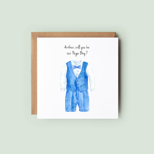 Personalised page boy proposal card with watercolour blue waistcoat and shorts suit, personalised text at top, shown as a square white 148x148mm (6x6) card with Kraft envelope behind.